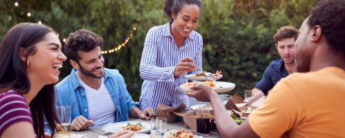 Friends eating outdoors